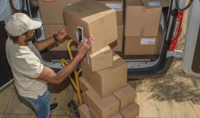 Man stacking boxes, commercial junk removal